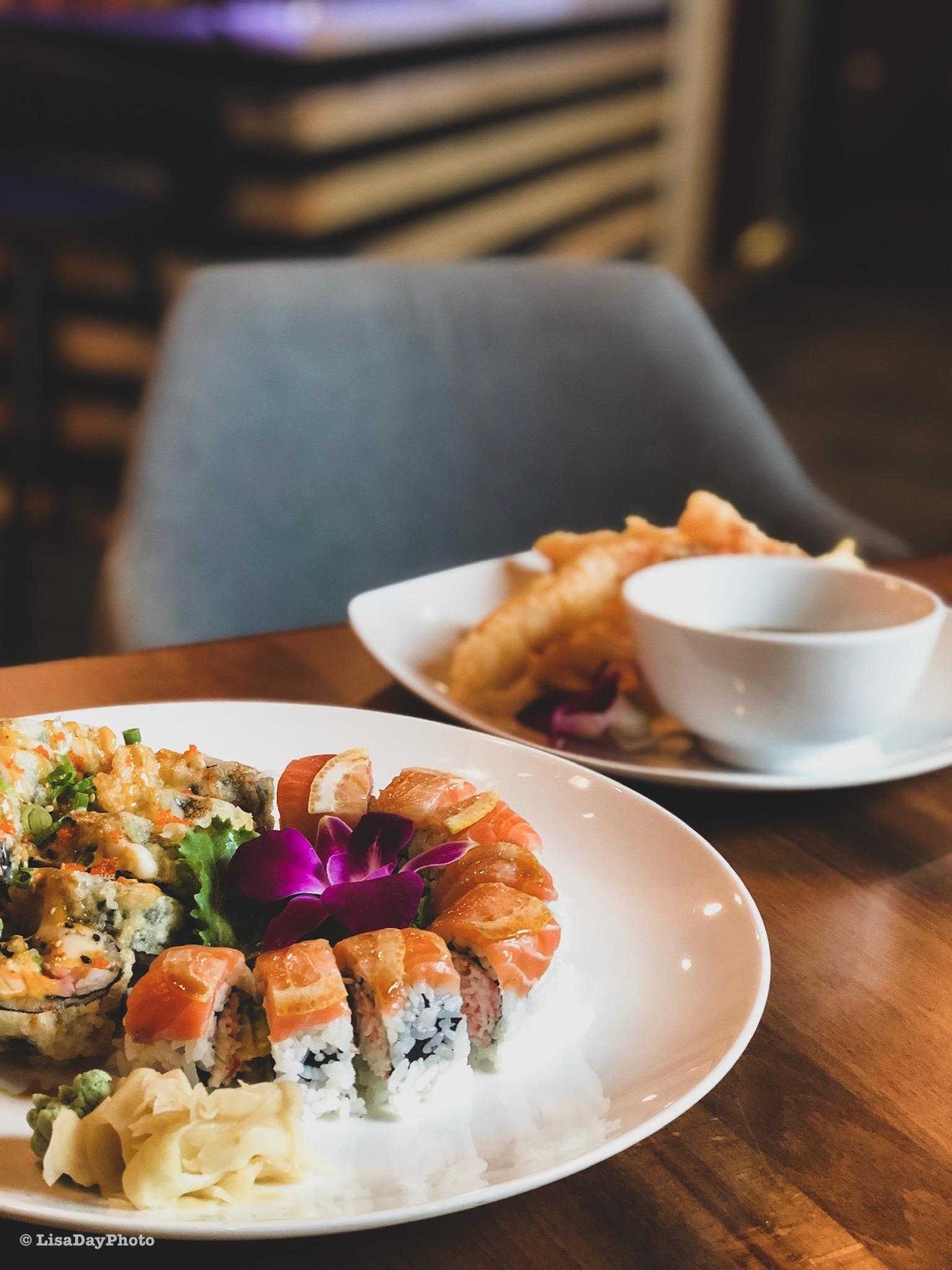 a plate of food on a wooden table.
