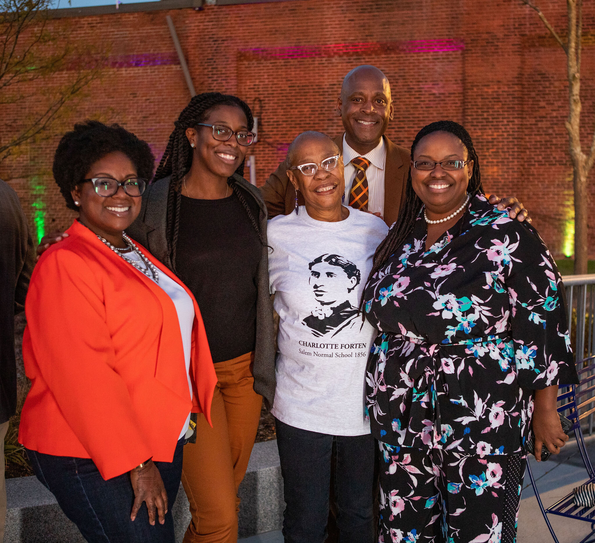 a group of people standing next to each other.