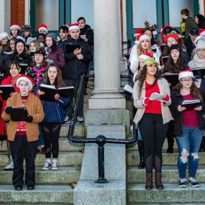 Large group of high school chorus children perform at City Hall in Peabody