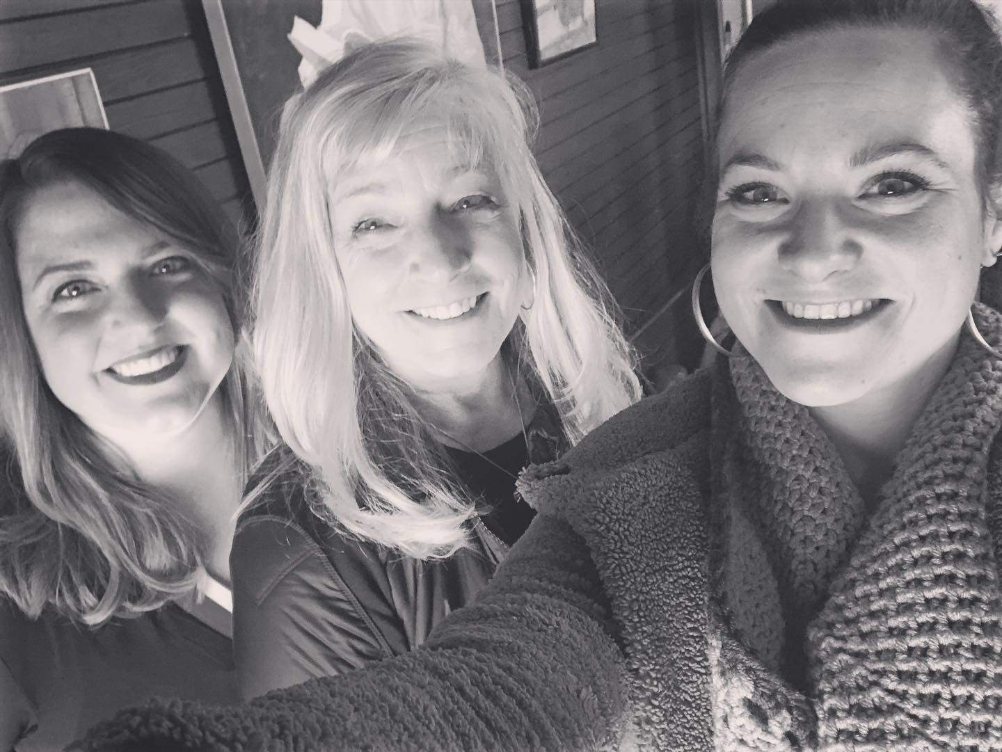 a group of women standing next to each other.