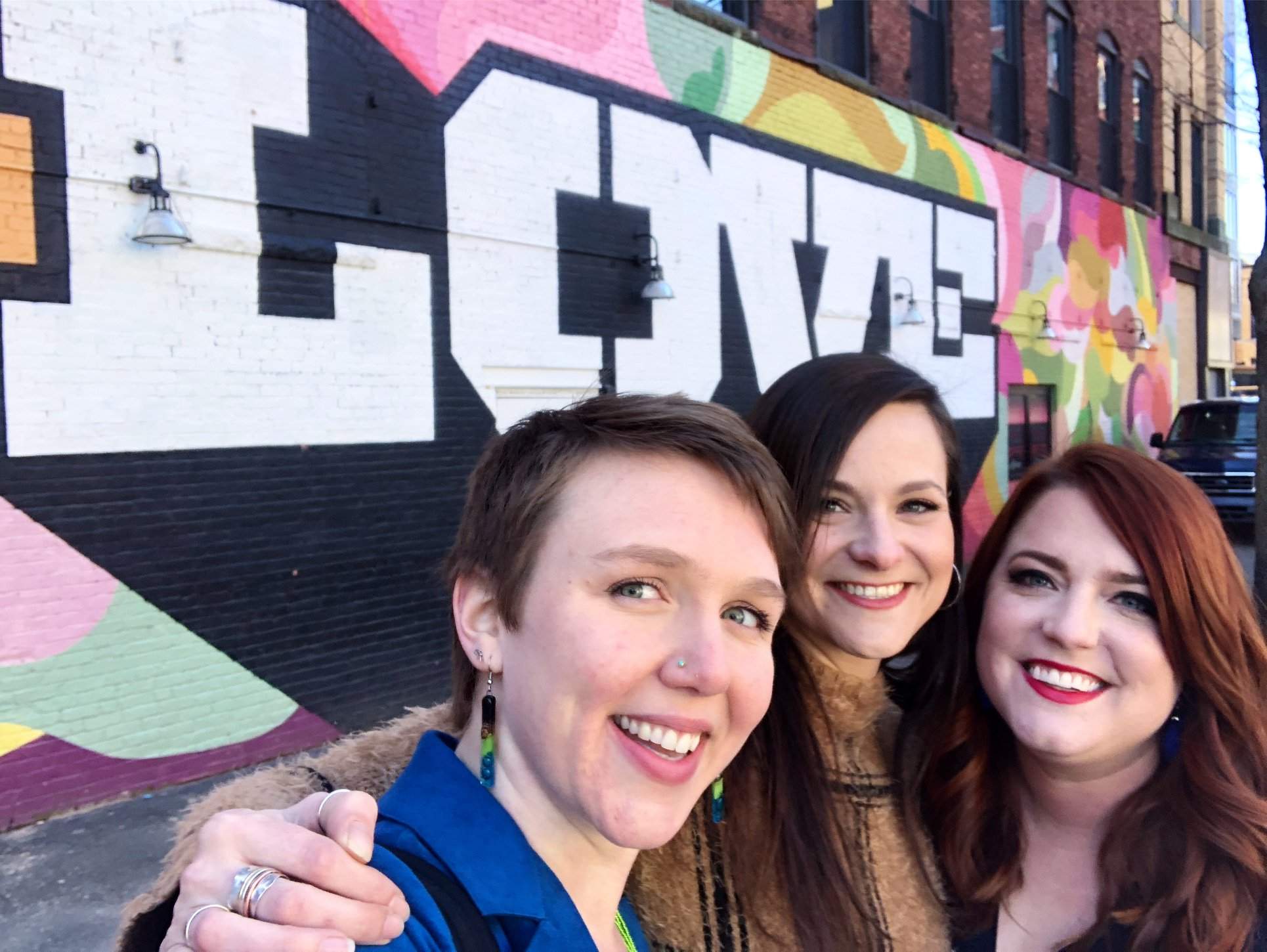 a group of women standing next to each other.