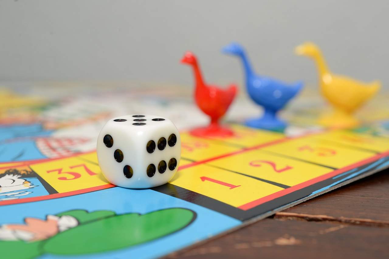 a close up of a dice on a board game.