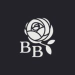 A beautiful white rose with leaves elegantly highlights the letters "BB" against a dark background, capturing the timeless charm of Briar Bar Inn.