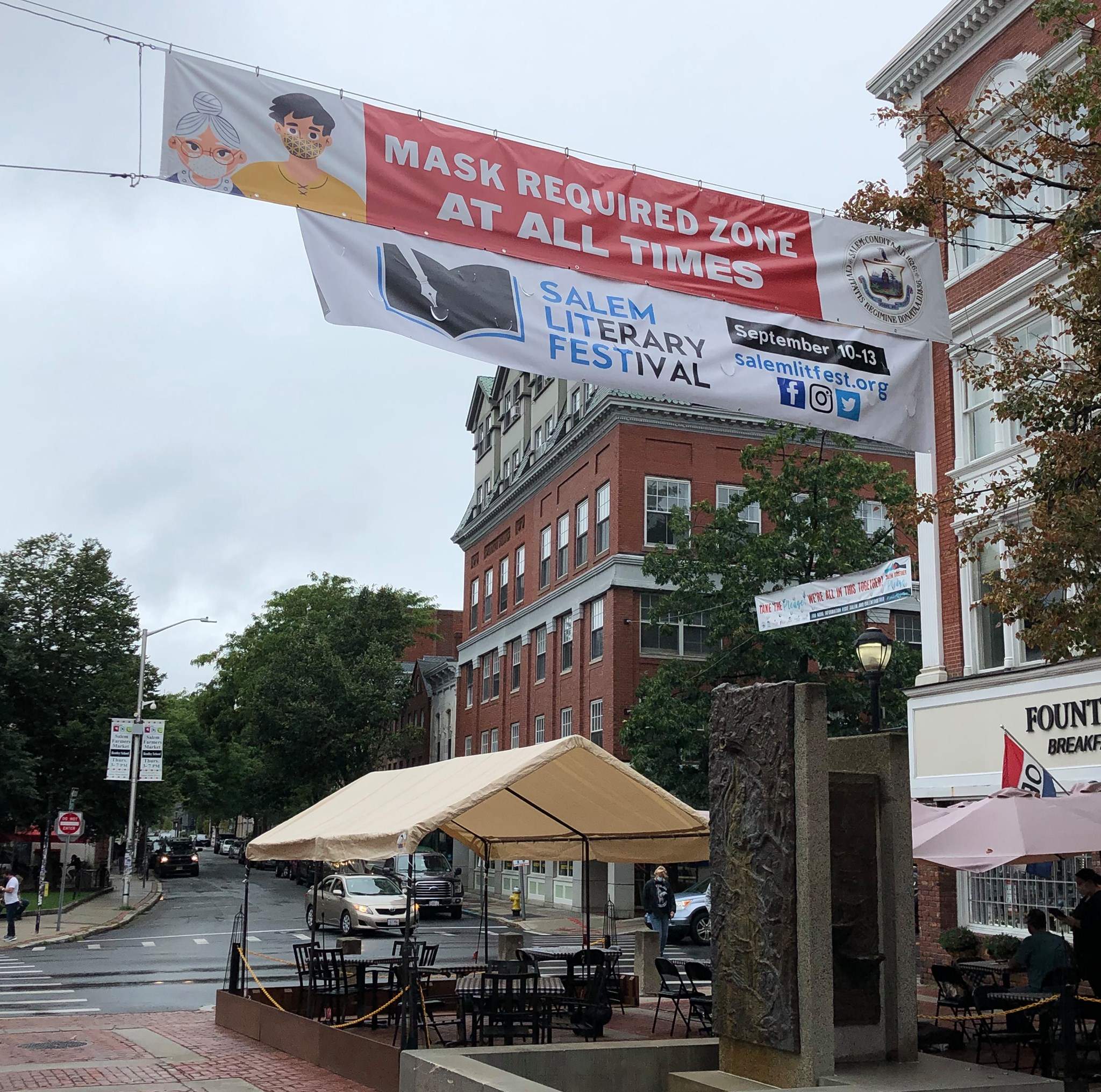 a banner hanging from the side of a building.