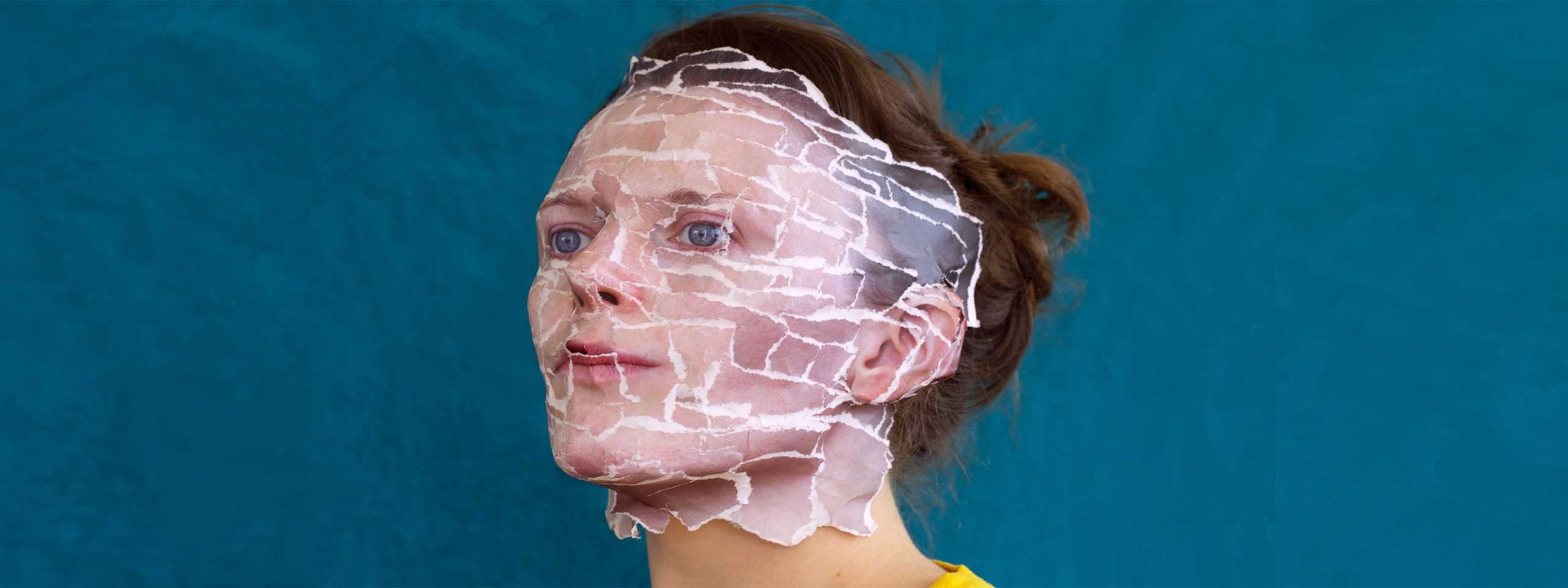 a woman with a plastic covering her face.