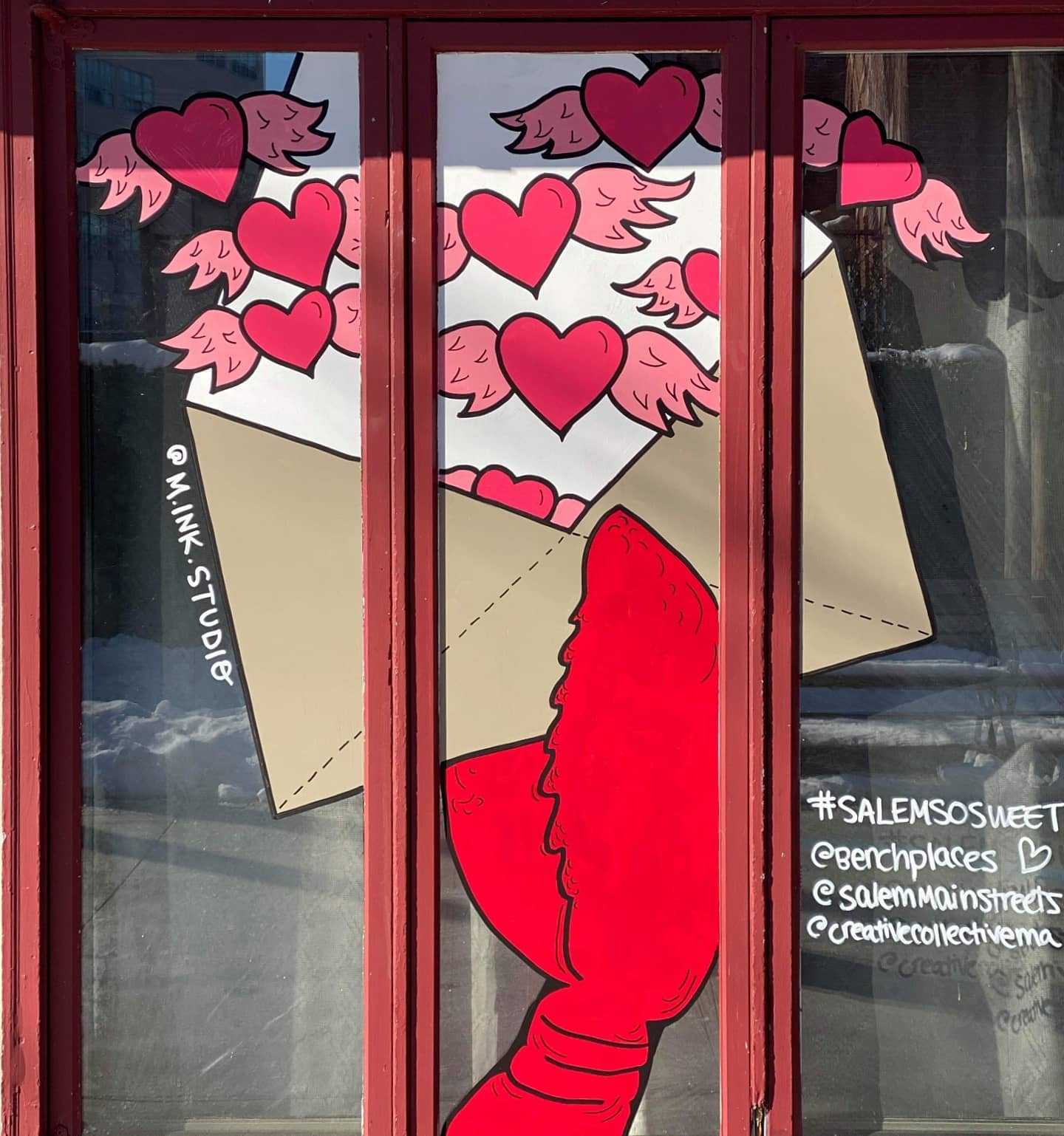 a red window with a picture of a lobster in it.