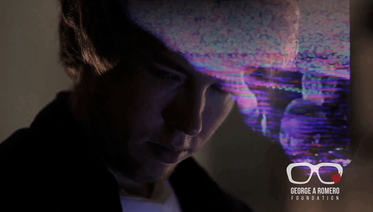 a man is looking at his cell phone.