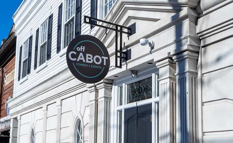 a sign on the side of a building that says off cabot.