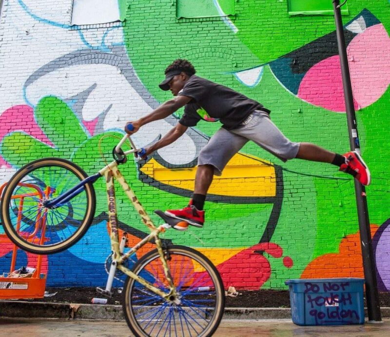 a man is doing a trick on a bike.