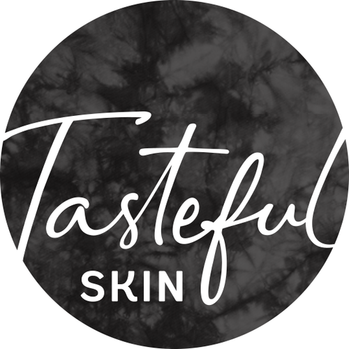 a black and white circle with the words tasteful skin.