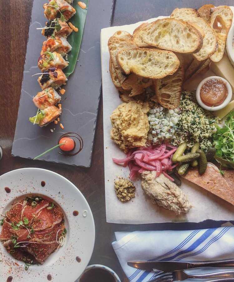 a plate of food on a wooden table.