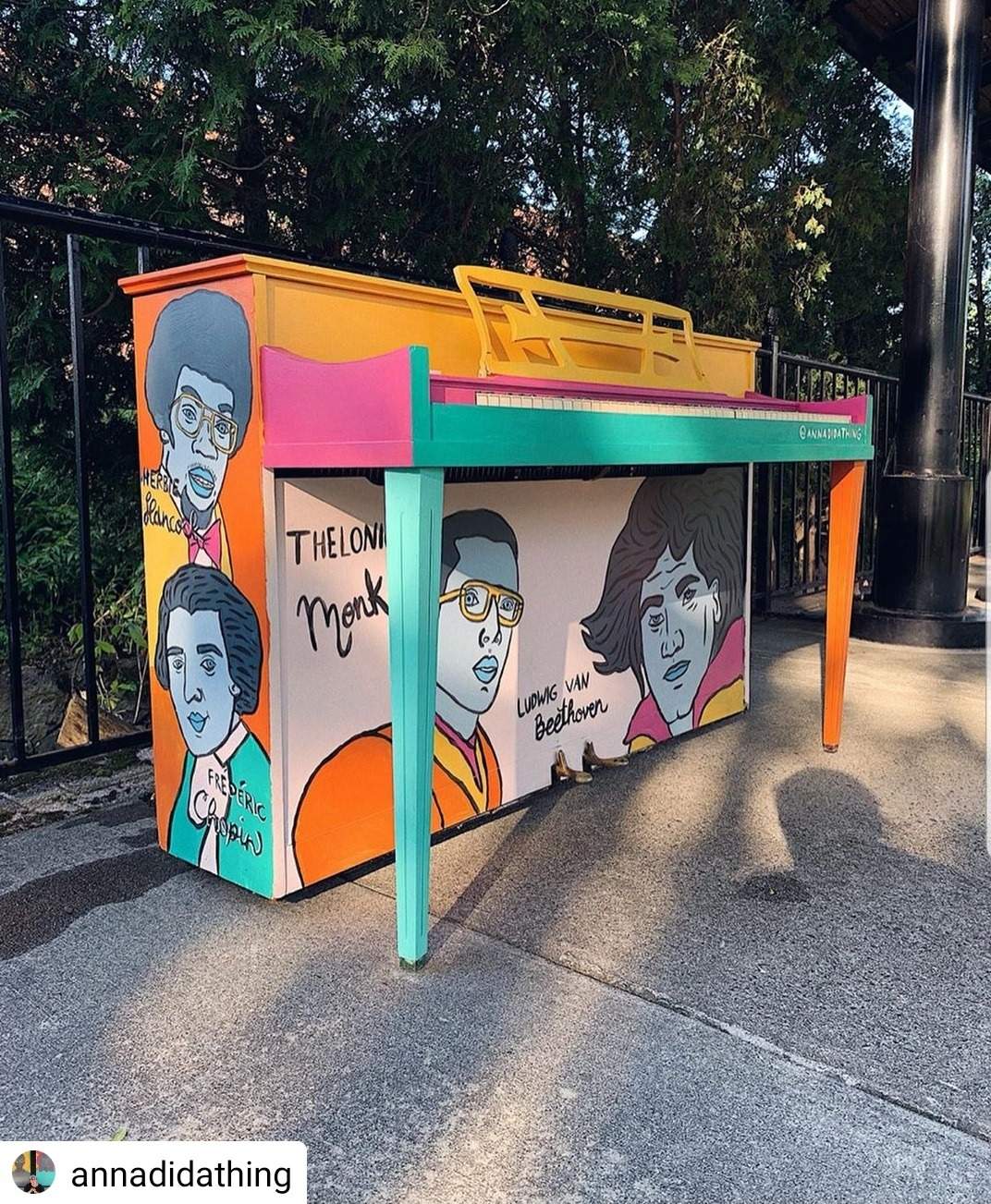 a colorful bench with a bunch of cartoon characters painted on it.