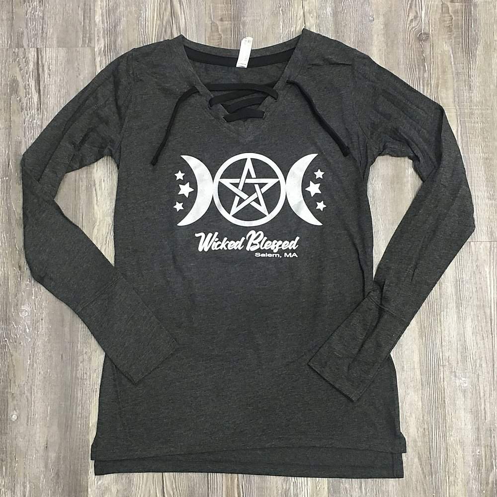 a women's long sleeved shirt with a pentagramil on the front.