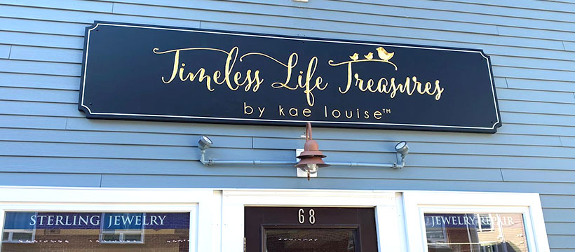a sign on the side of a building that says timely life treasures by joe lou.