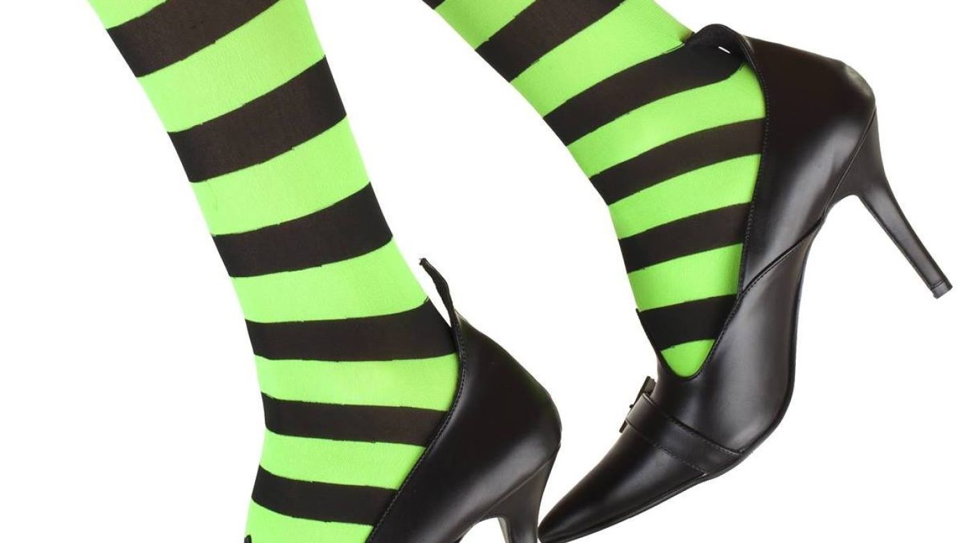 two legs wearing black and green striped tights and black heeled witch shoes