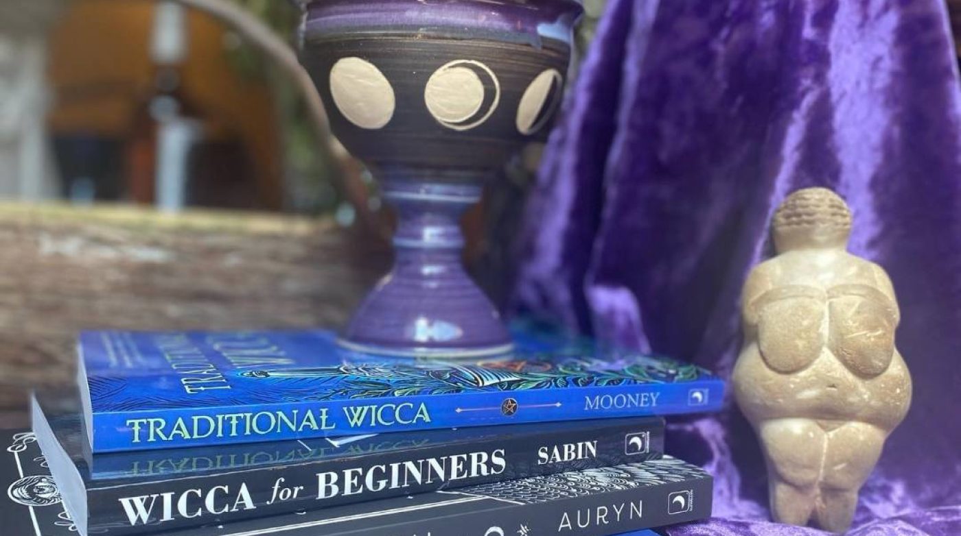 a stack of books sitting on top of a table.