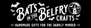 The logo features a striking image of a cathedral tower with bats, perfectly reflecting the brand name "Bats in the Belfry Crafts." Below, you'll discover the intriguing promise: "Handmade gifts for the darkly minded." This tagline encapsulates everything Bats in the Belfry Crafts stands for—unique, hand-crafted items with an edge.