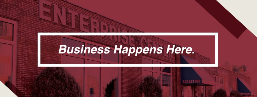 a banner reads "business happens here." white text on red background