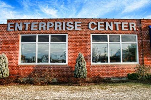 a brick building with a sign that says enterprise center.