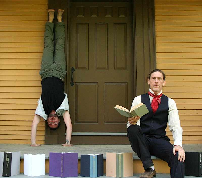 a man and a woman doing a handstand in front of a door.
