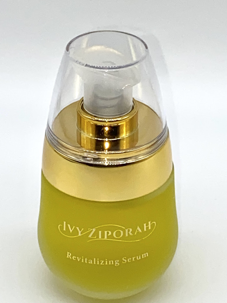 A spring green perfume bottle with a clear lid reads "Ivy Ziporah"