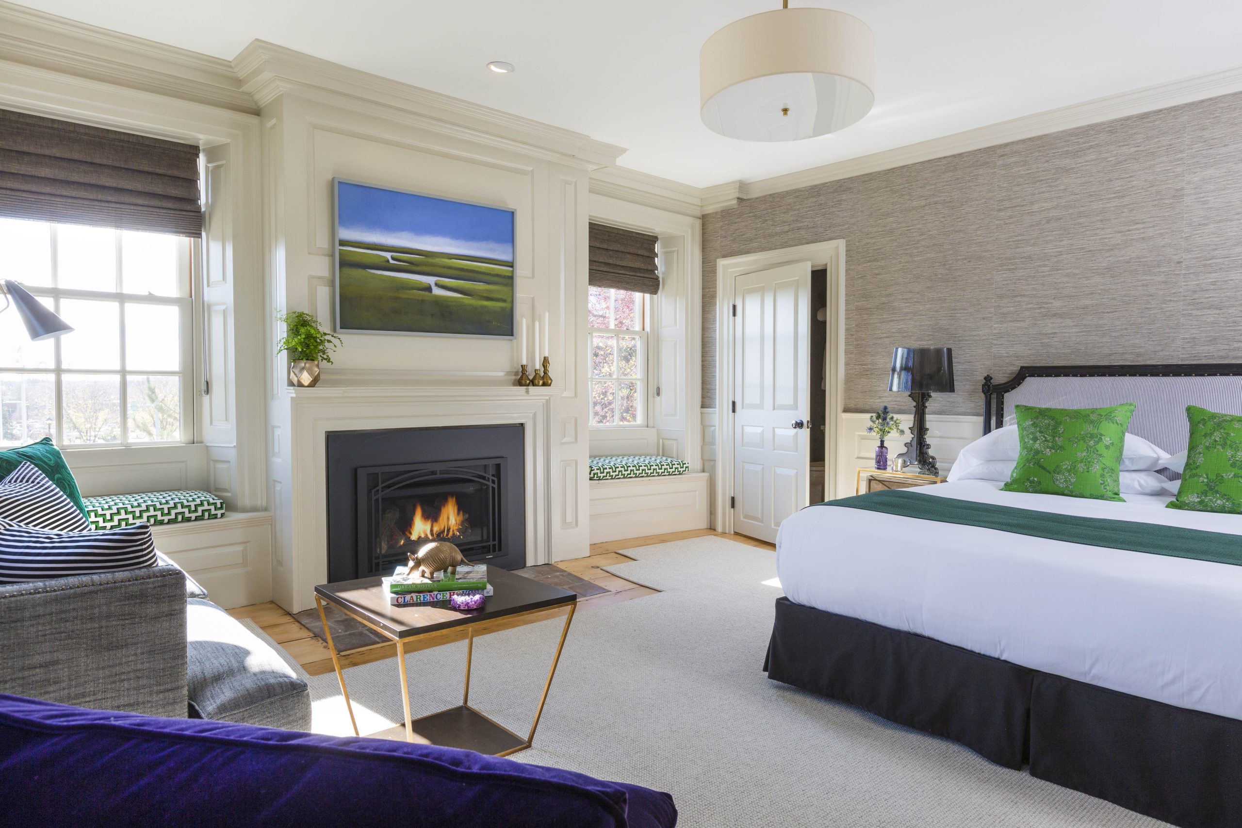 a bedroom with a fireplace and a bed.