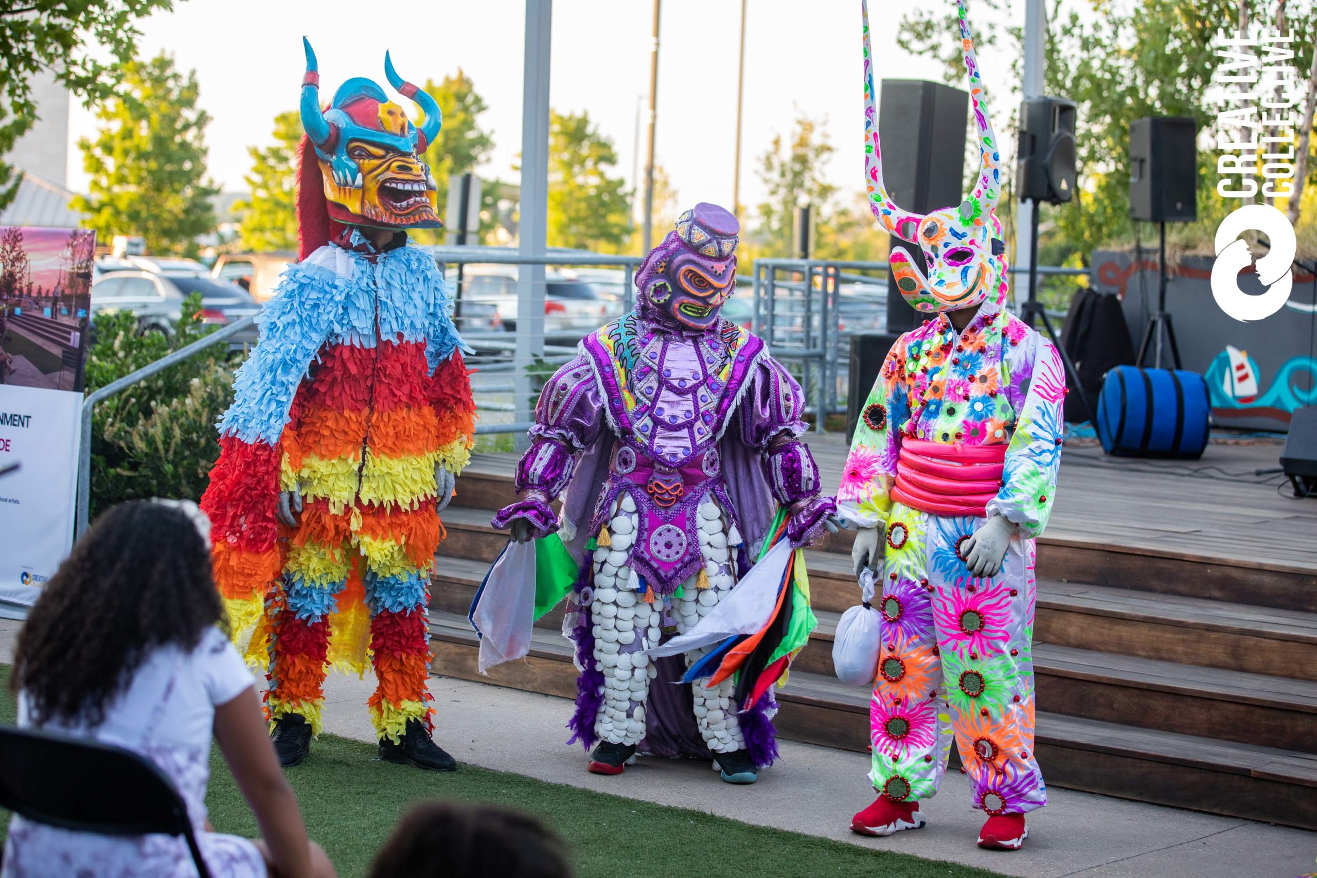 a group of people dressed in colorful costumes.