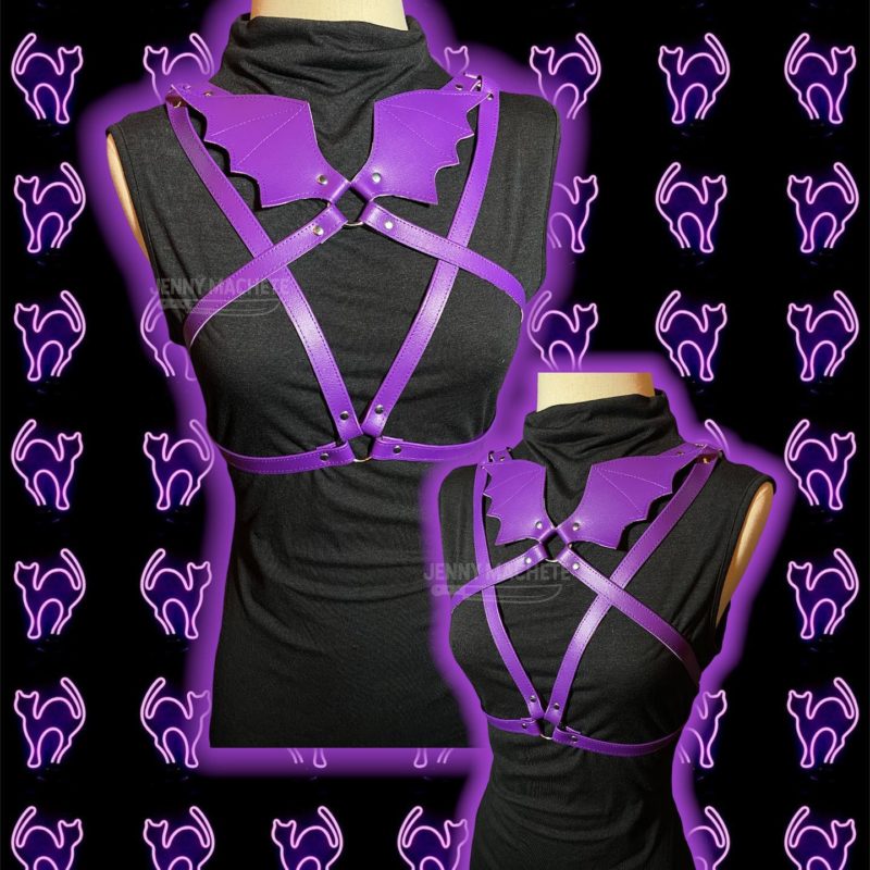 a mannequin with purple straps and a black top.