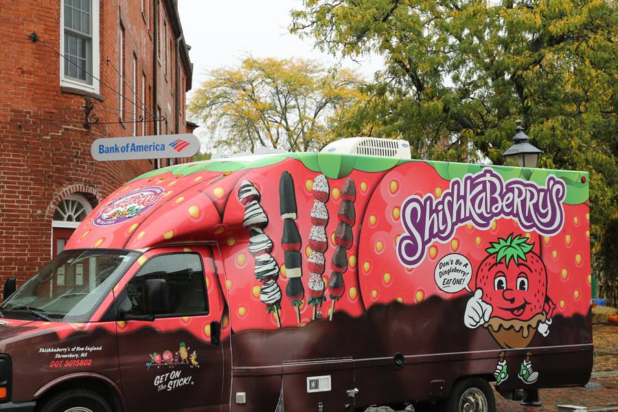 a truck that is painted like a strawberry.