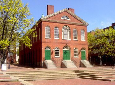 a red brick building with steps leading up to it.