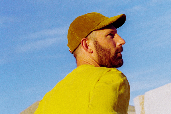 a man in a yellow shirt and a yellow hat.