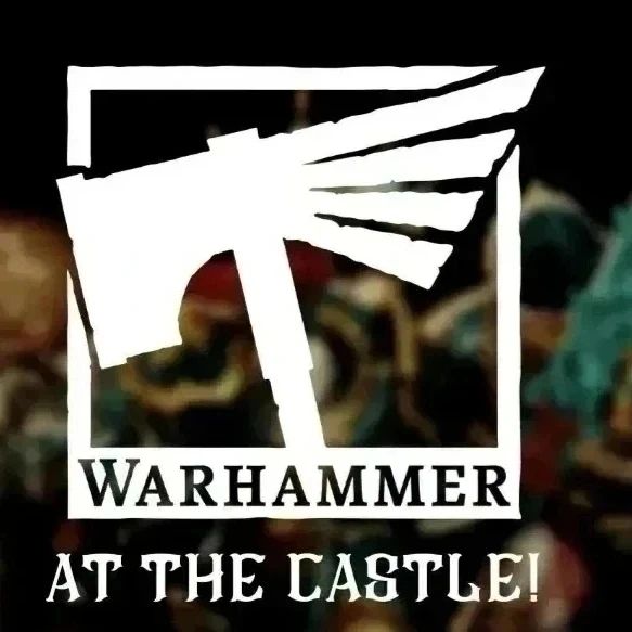 a white sign that says warhammer at the castle.