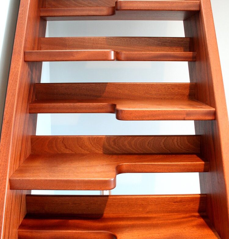 a set of wooden stairs in a room.
