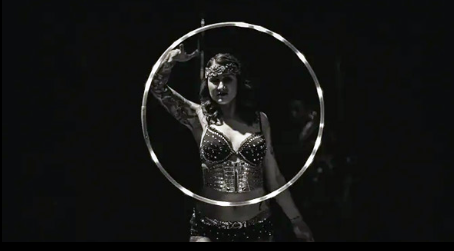 a woman with a hoop around her neck.