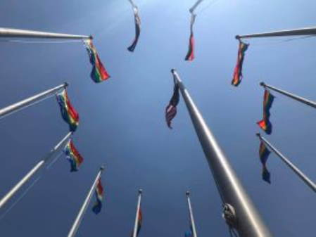 a group of flags that are flying in the air.