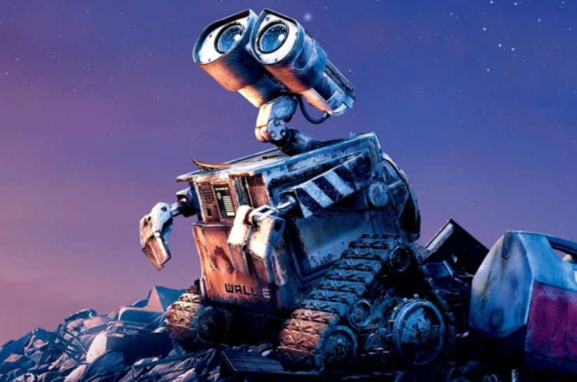 a robot sitting on top of a pile of junk.