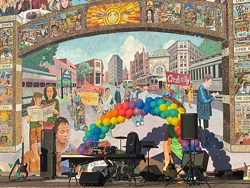 a stage set up in front of a mural.