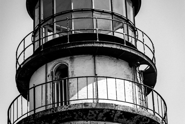 a black and white photo of a lighthouse.