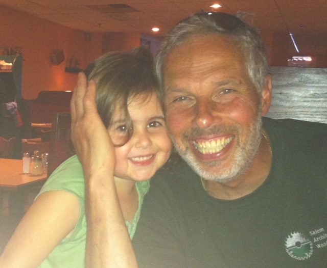 a man and a little girl posing for a picture.