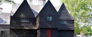 A black house with a red door.