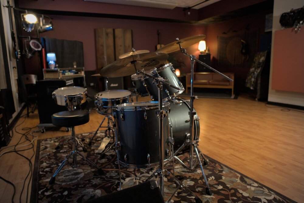 A drum set in a recording studio.