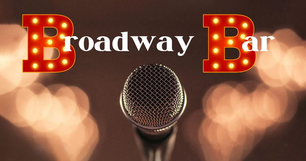 Broadway bar logo with a microphone in front of it.