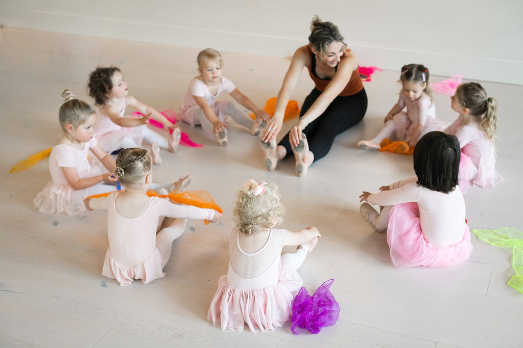 A group of children participating in a dance session during Small Business Saturday at a dance studio.