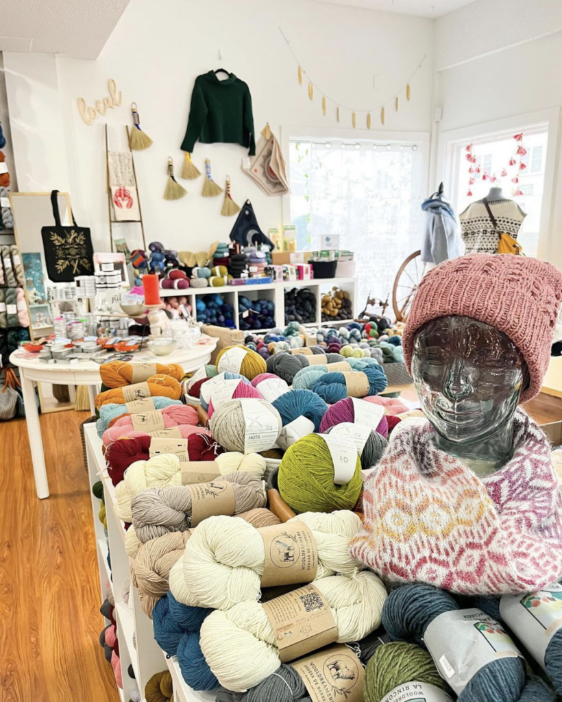 Visit our small business shop filled with yarn and a hat on Small Business Saturday.