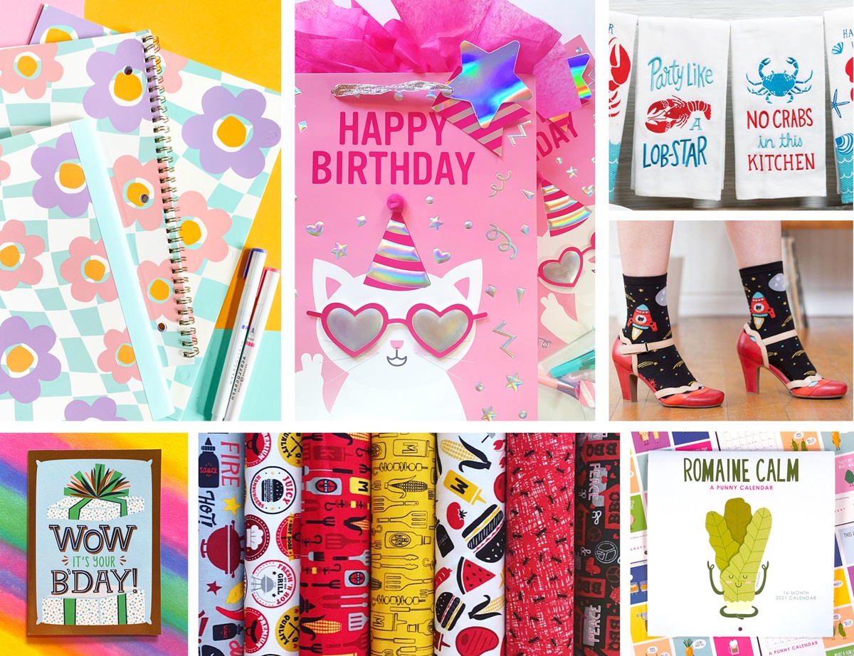 A mixed assortment of birthday cards, writing pads and various other products.