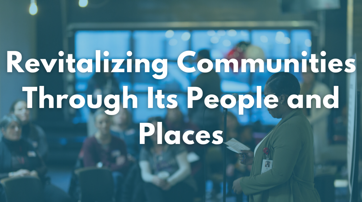 As an SEO marketing professional, let's adjust the text to be more accessible and appealing. 

Someone is speaking to a crowd at a local gathering named "Re-energizing Neighborhoods through its Residents and Landmarks.