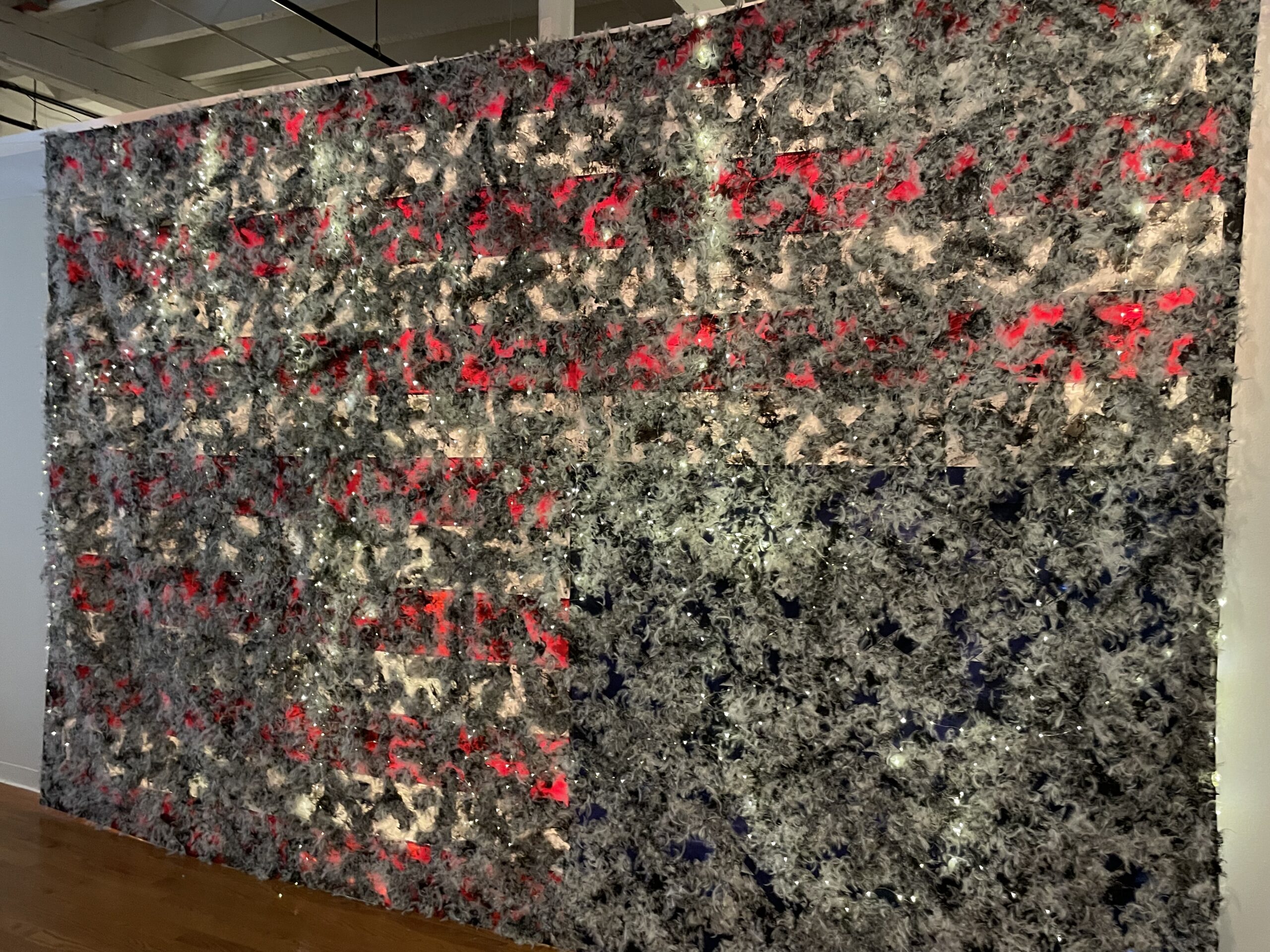 Experience the striking blend of red and gray in our latest textured abstract wall installation, showcased in a captivating gallery environment. This eye-catching piece is designed to engage viewers and leave a lasting impression with its unique patterns. Perfect for art enthusiasts looking to enhance their space with creativity and style.