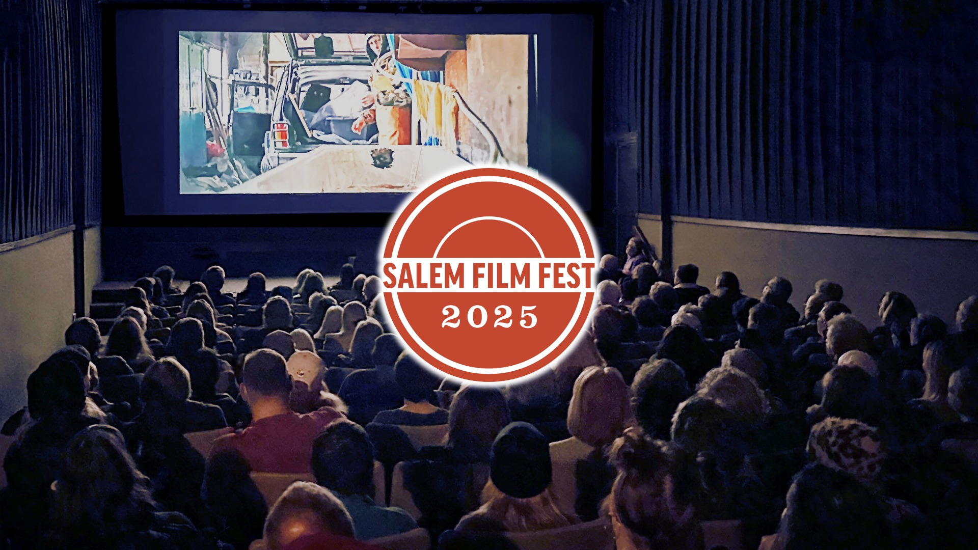 Experience the magic of cinema at Salem Film Fest 2025! Picture yourself in a cozy theater, the anticipation in the air as you get ready to watch another captivating film. Right up front, you'll spot the eye-catching festival logo, reminding you you're part of something special. If you're a film lover looking for an unforgettable experience, this is where you want to be. Join us and dive into exciting storytelling from around the world!.