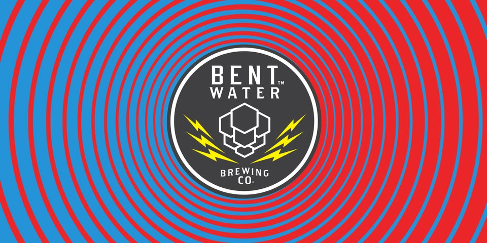 Place the Bent Water Brewing Co. logo prominently in the center, featuring a striking black hexagon with vibrant yellow lightning bolts. This bold design is encircled by eye-catching red and blue rings, creating an attention-grabbing visual that enhances brand recognition.