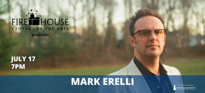 A man in glasses and a light jacket stands outside with trees behind him. Don’t miss Mark Erelli performing live at Firehouse Center for the Arts on July 17 at 7PM.